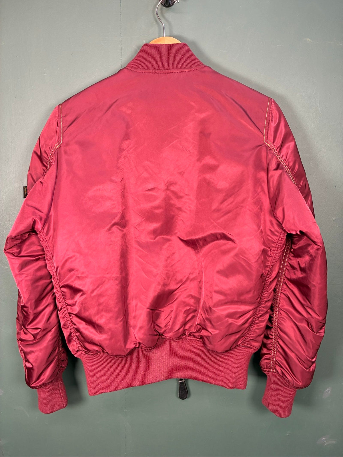 Alpha Industries burgundy bomber jacket reversible with yellow and red accents, excellent condition.