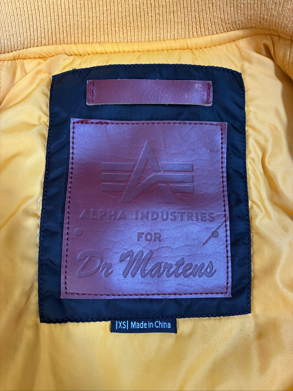 Alpha Industries burgundy bomber jacket reversible with yellow and red accents, excellent condition.