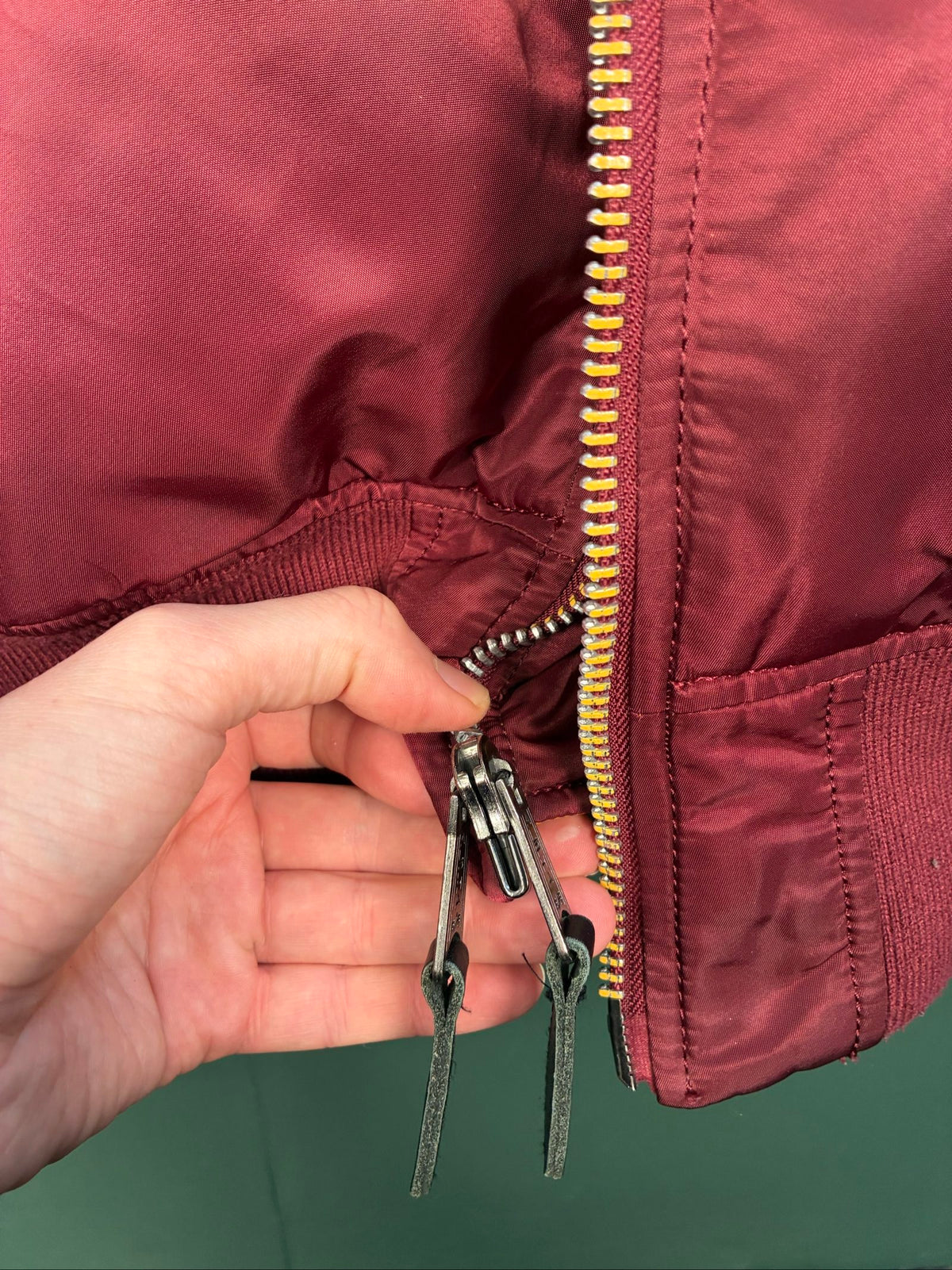 Alpha Industries burgundy bomber jacket reversible with yellow and red accents, excellent condition.