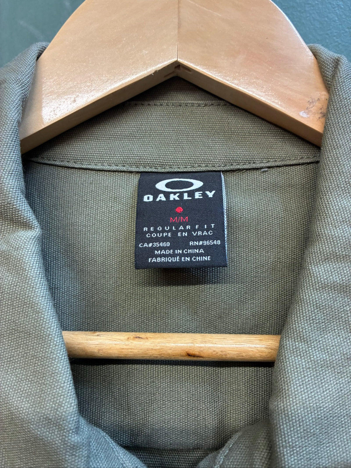Oakley khaki military field jacket with breast and side pockets, regular fit.