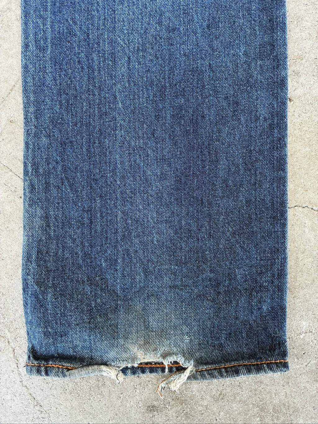 Evisu blue denim jeans with koi fish embroidery and logo, vintage Japanese style.
