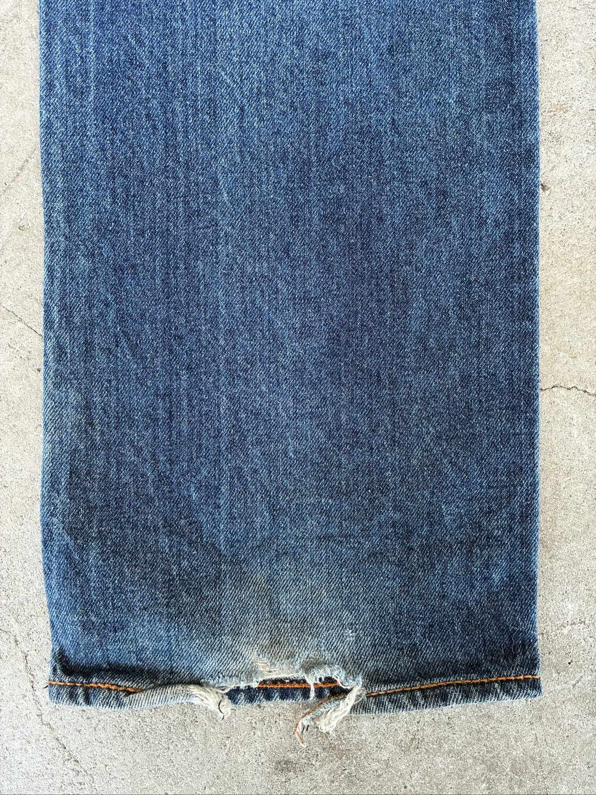 Evisu blue denim jeans with koi fish embroidery and logo, vintage Japanese style.