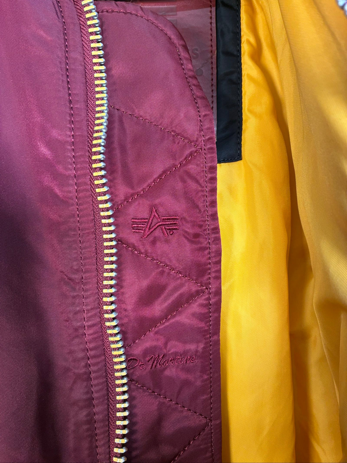 Alpha Industries burgundy bomber jacket reversible with yellow and red accents, excellent condition.