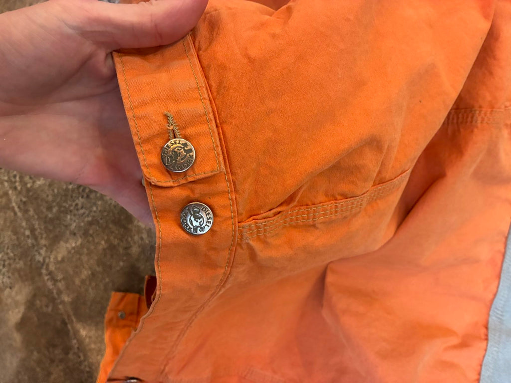 Diesel orange and grey hooded jacket with insulated design and vintage 90s style.