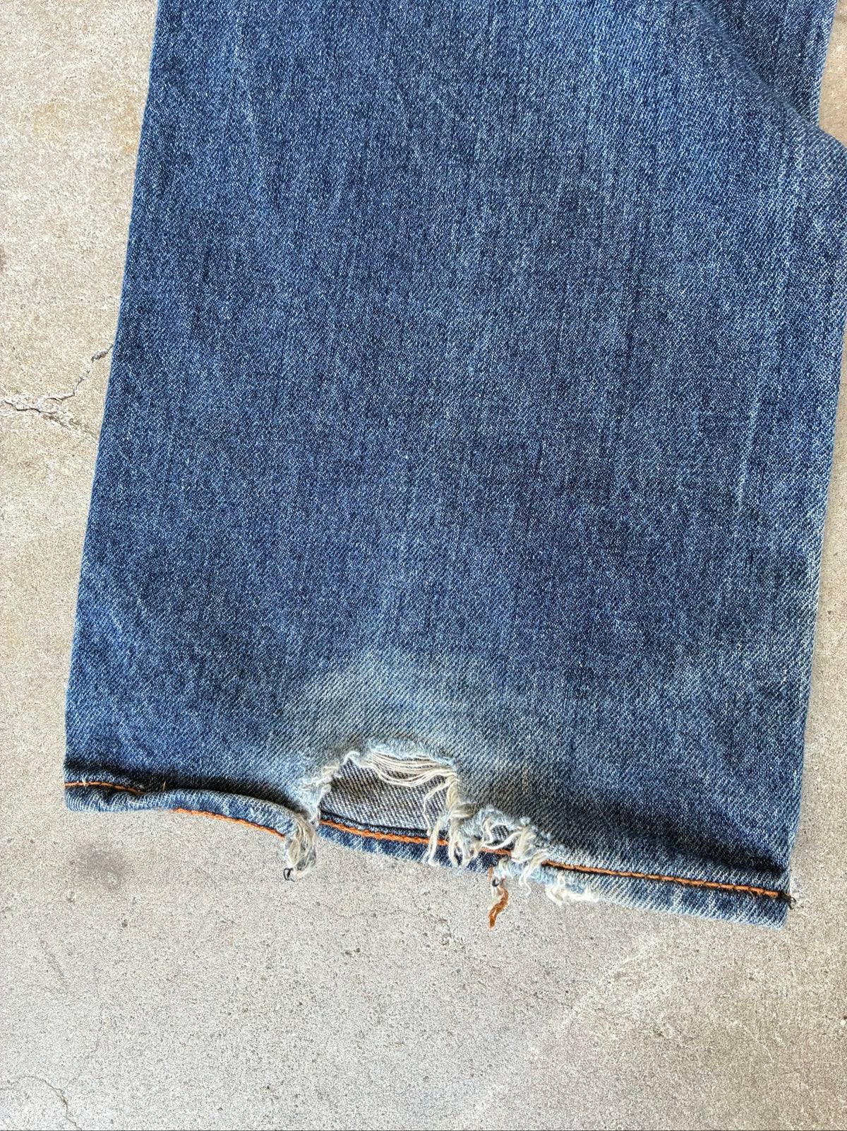 Evisu blue denim jeans with koi fish embroidery and logo, vintage Japanese style.
