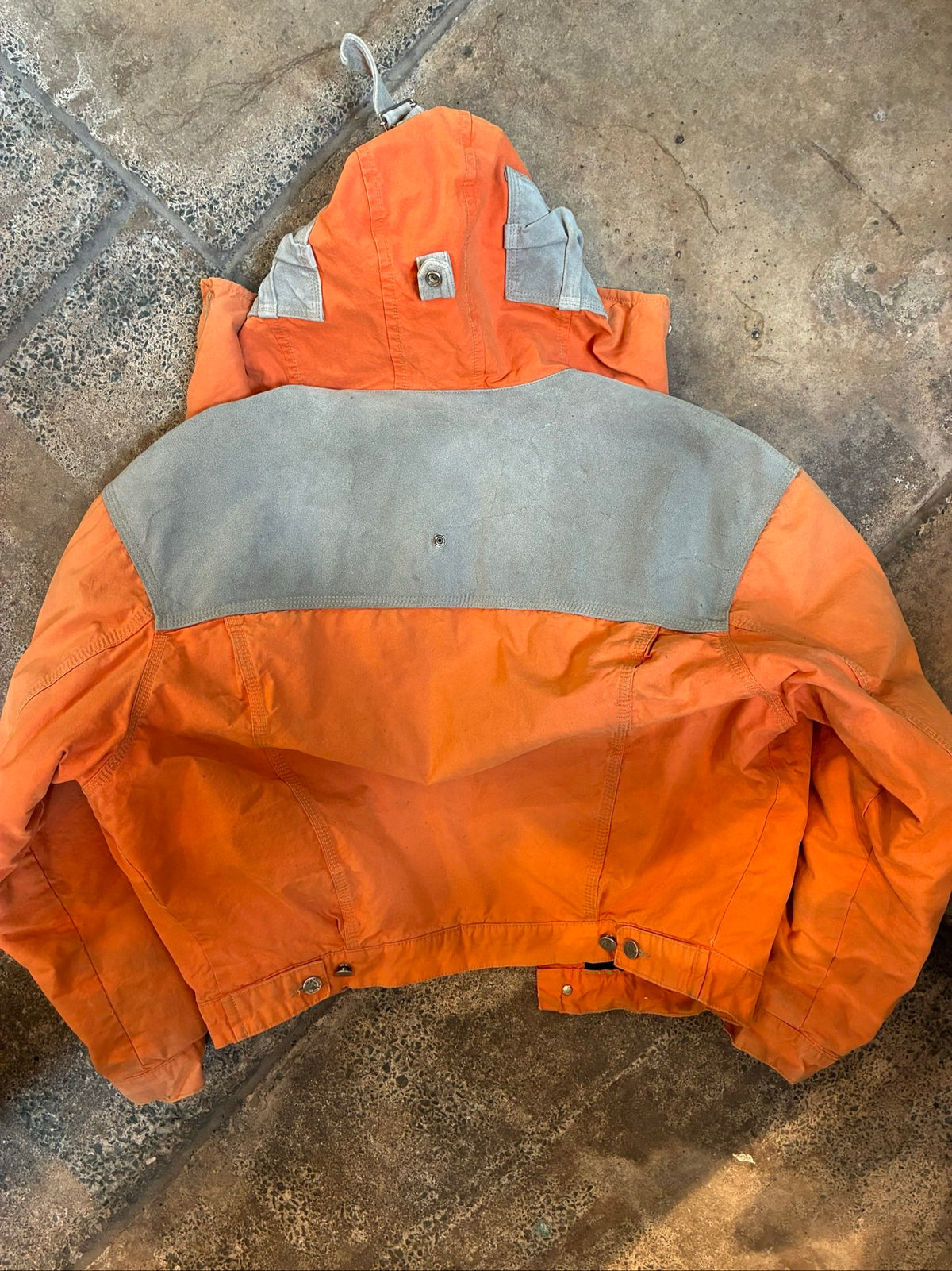 Diesel orange and grey hooded jacket with insulated design and vintage 90s style.