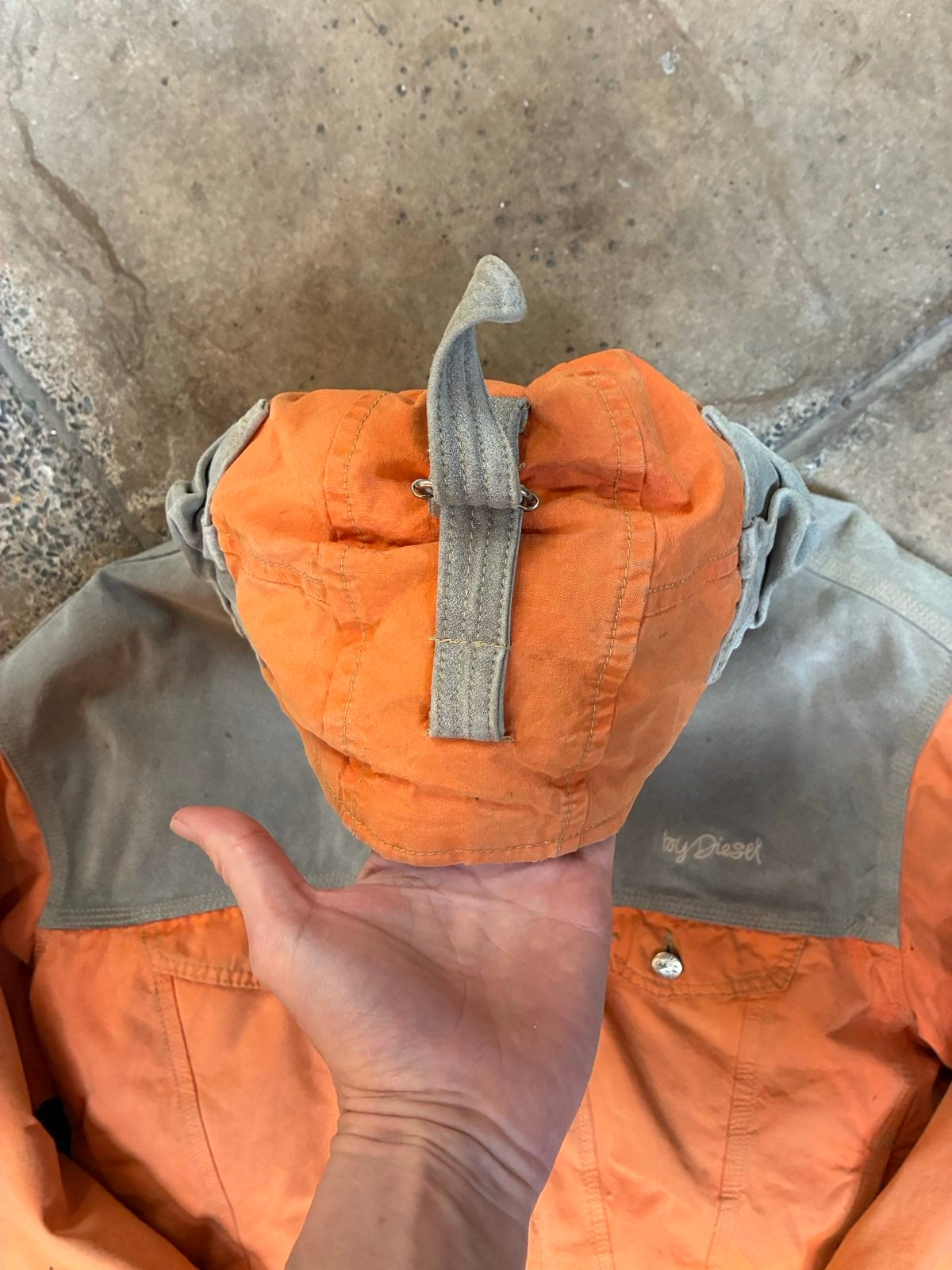Diesel orange and grey hooded jacket with insulated design and vintage 90s style.