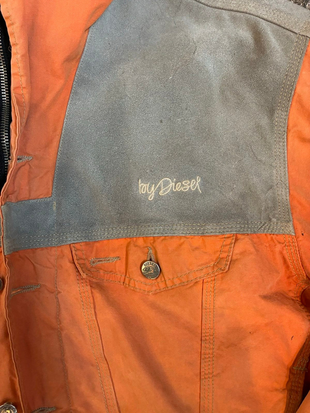 Diesel orange and grey hooded jacket with insulated design and vintage 90s style.