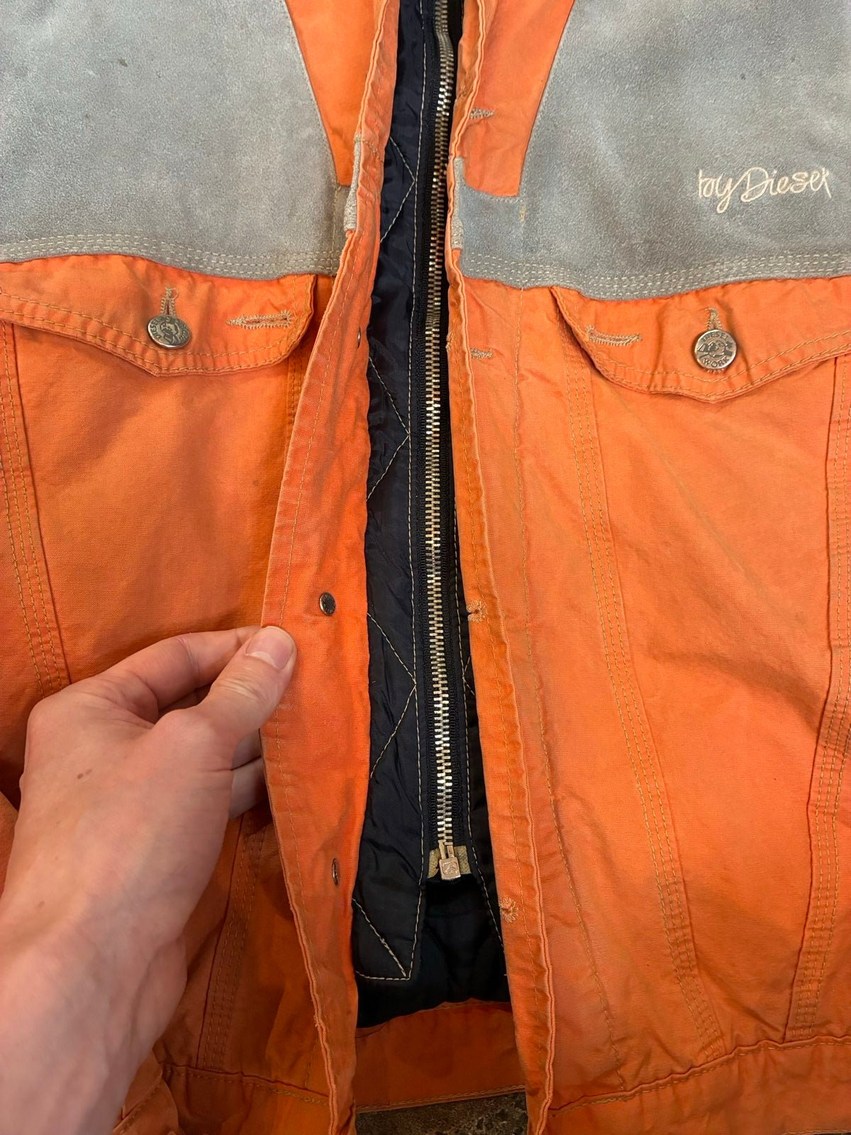 Diesel orange and grey hooded jacket with insulated design and vintage 90s style.
