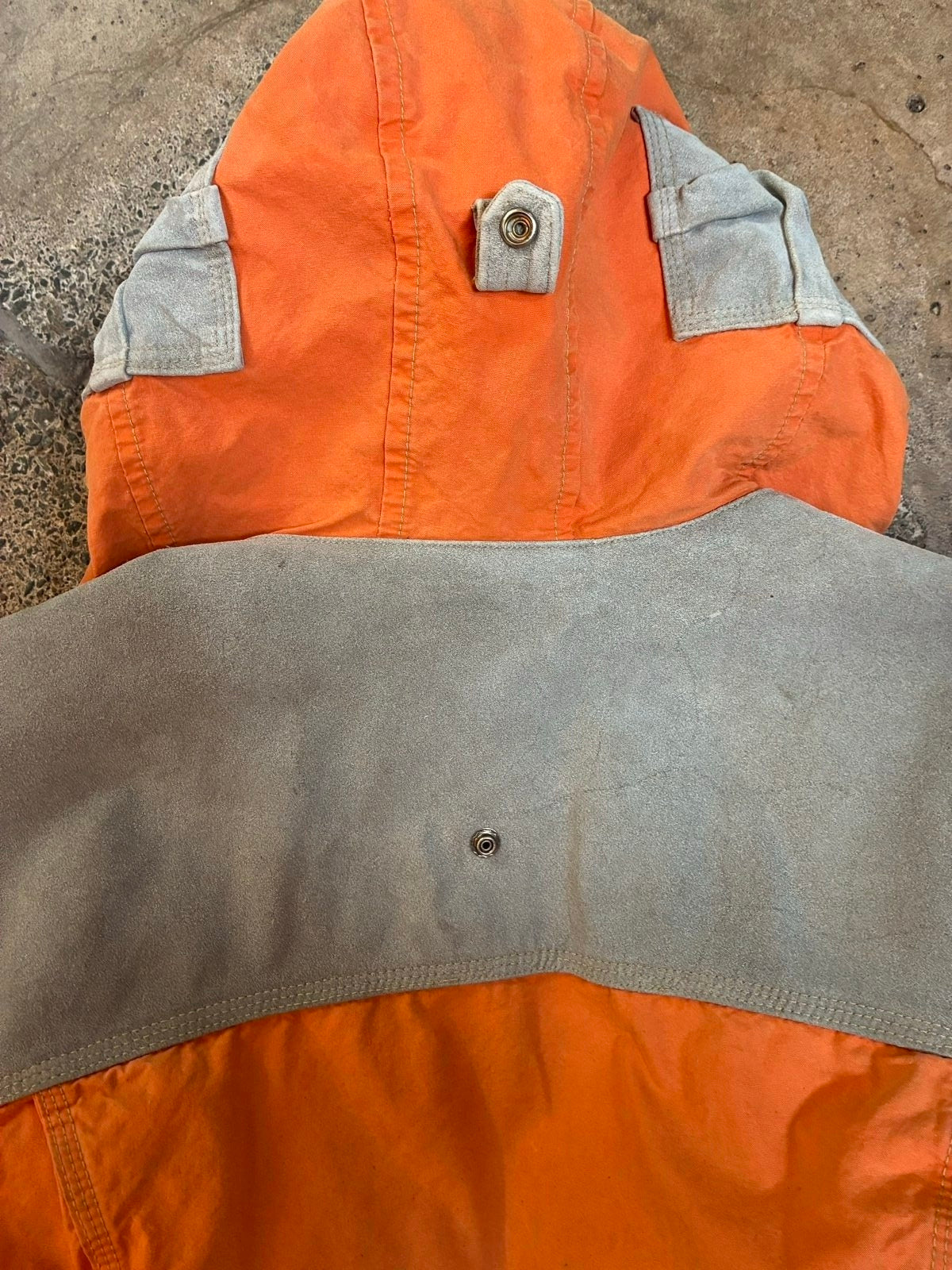 Diesel orange and grey hooded jacket with insulated design and vintage 90s style.