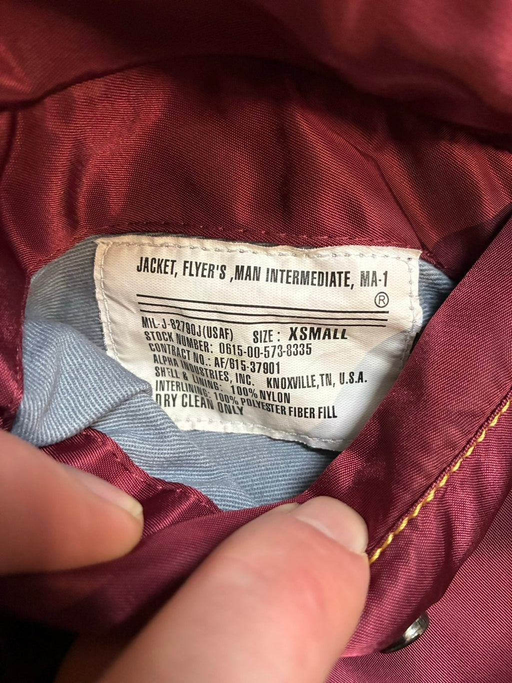 Alpha Industries burgundy bomber jacket reversible with yellow and red accents, excellent condition.