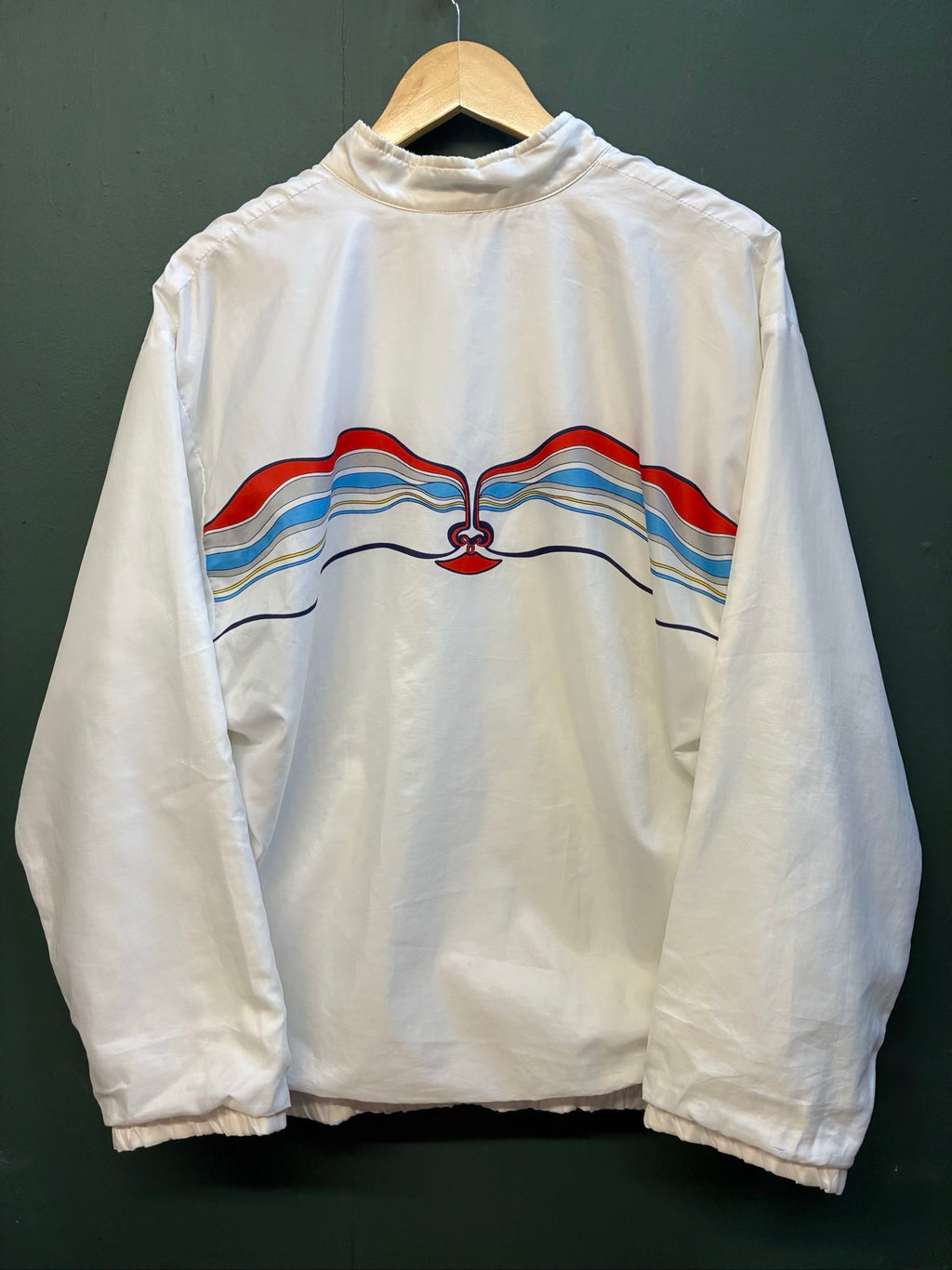 Adidas vintage blue, red, and white track jacket with logo and 80s design.