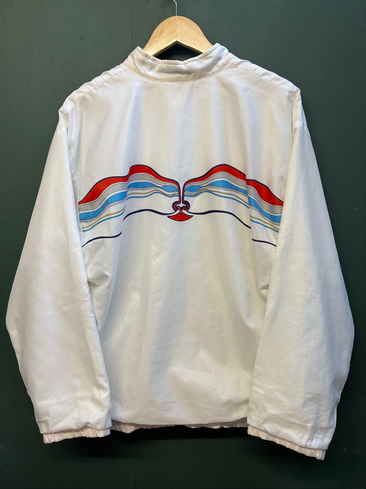 Adidas vintage blue, red, and white track jacket with logo and 80s design.