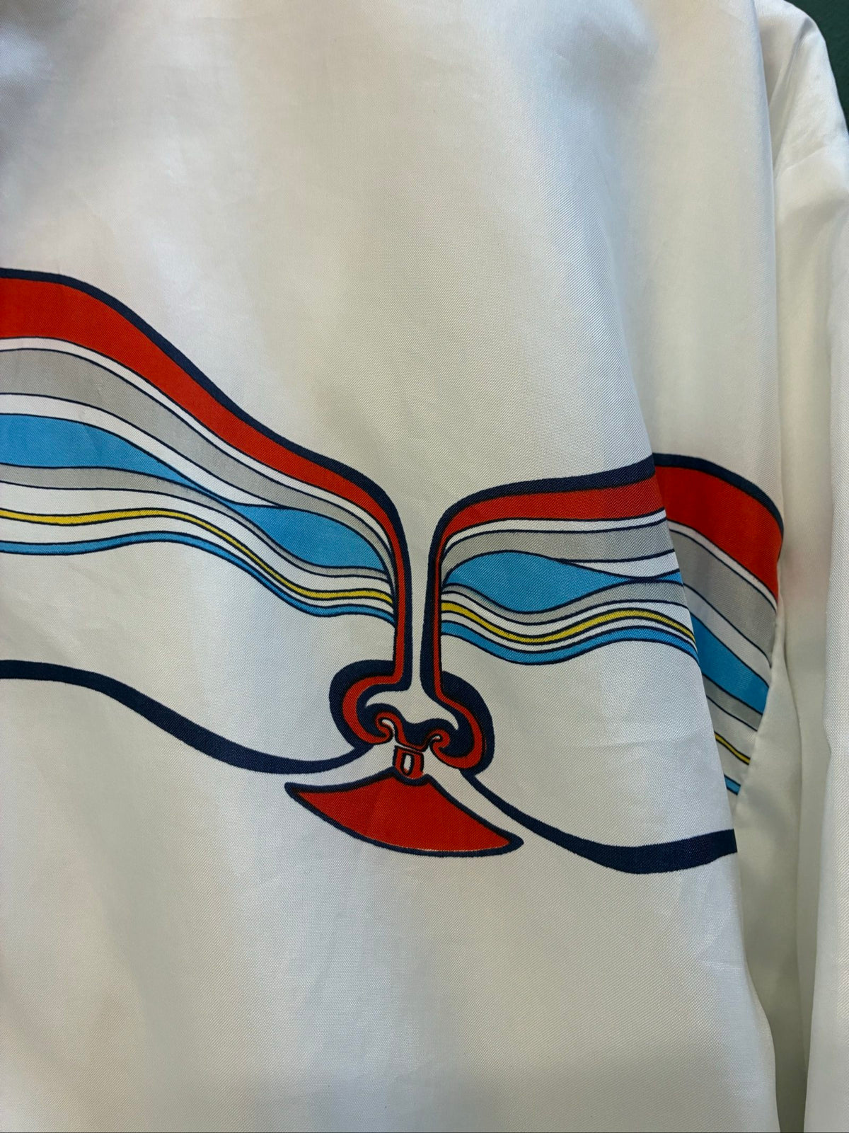 Adidas vintage blue, red, and white track jacket with logo and 80s design.
