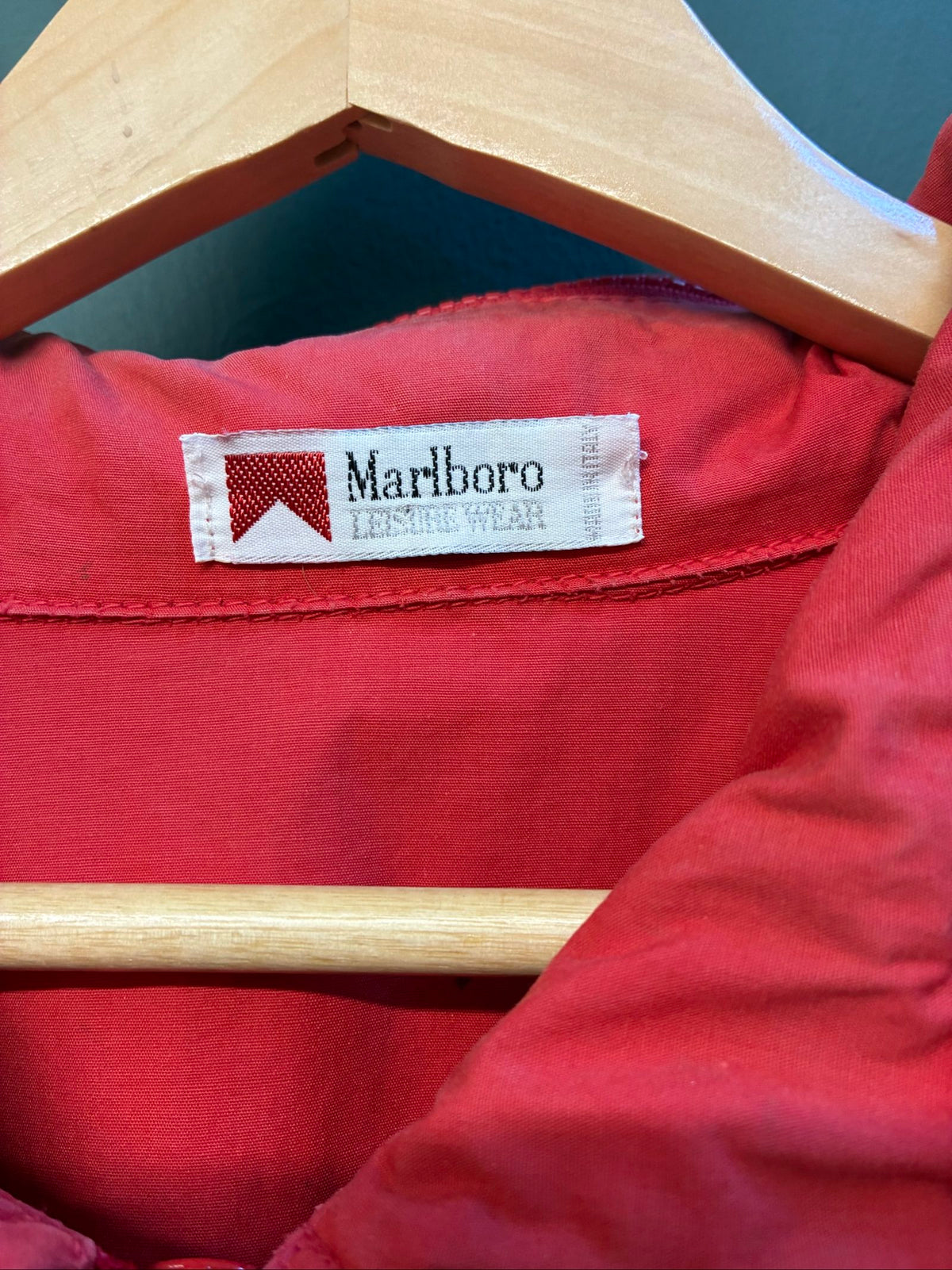 Marlboro vintage red cotton jacket with hood, snap pockets, subtle branding, 80s style.