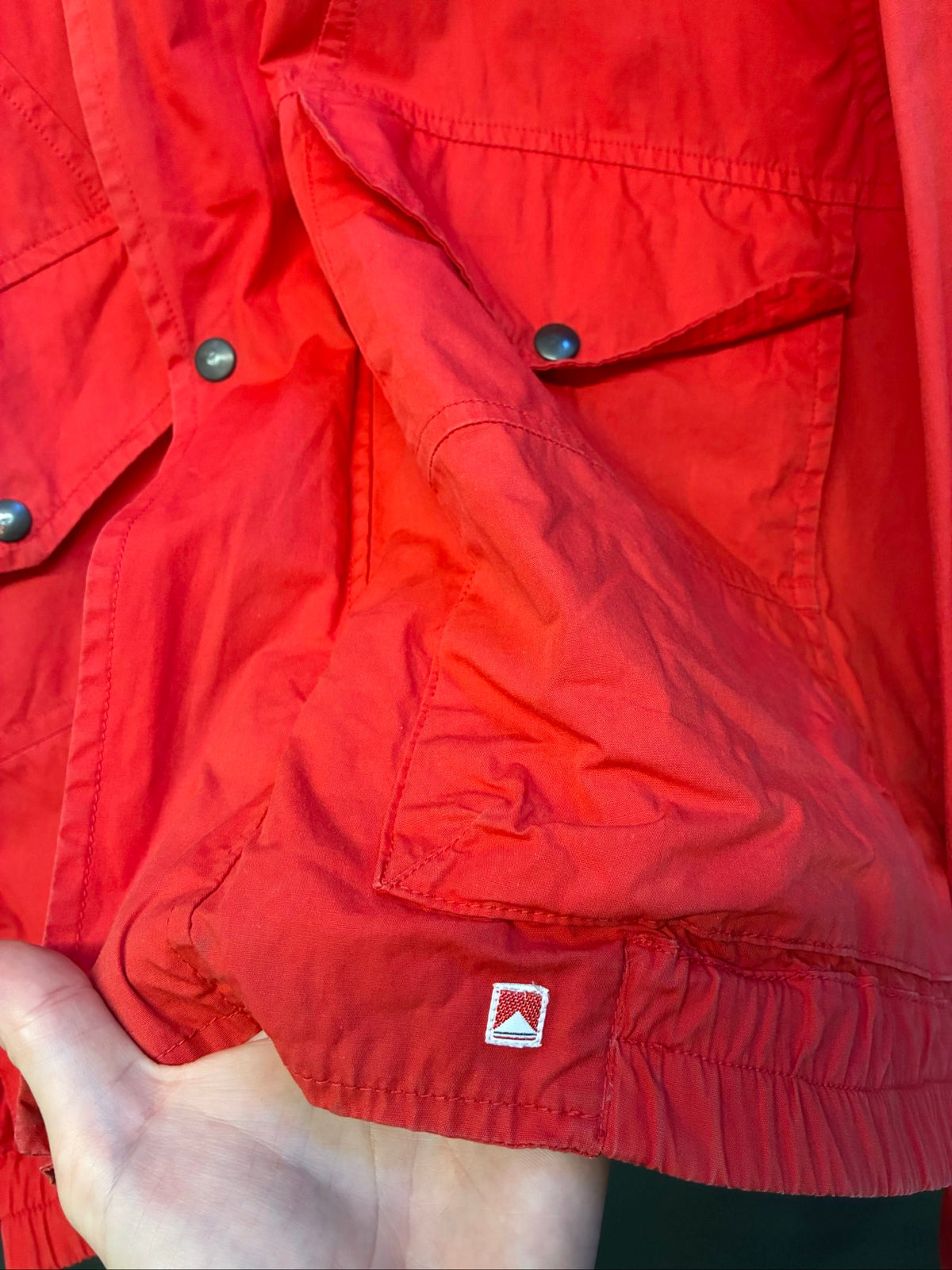 Marlboro vintage red cotton jacket with hood, snap pockets, subtle branding, 80s style.