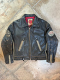 Diesel beige and black leather motorcycle jacket with quilted insulation and zipper pockets.