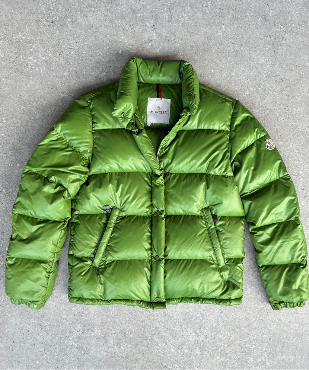 Moncler green puffer jacket with logo, 2004-2008, small oil mark below left arm.