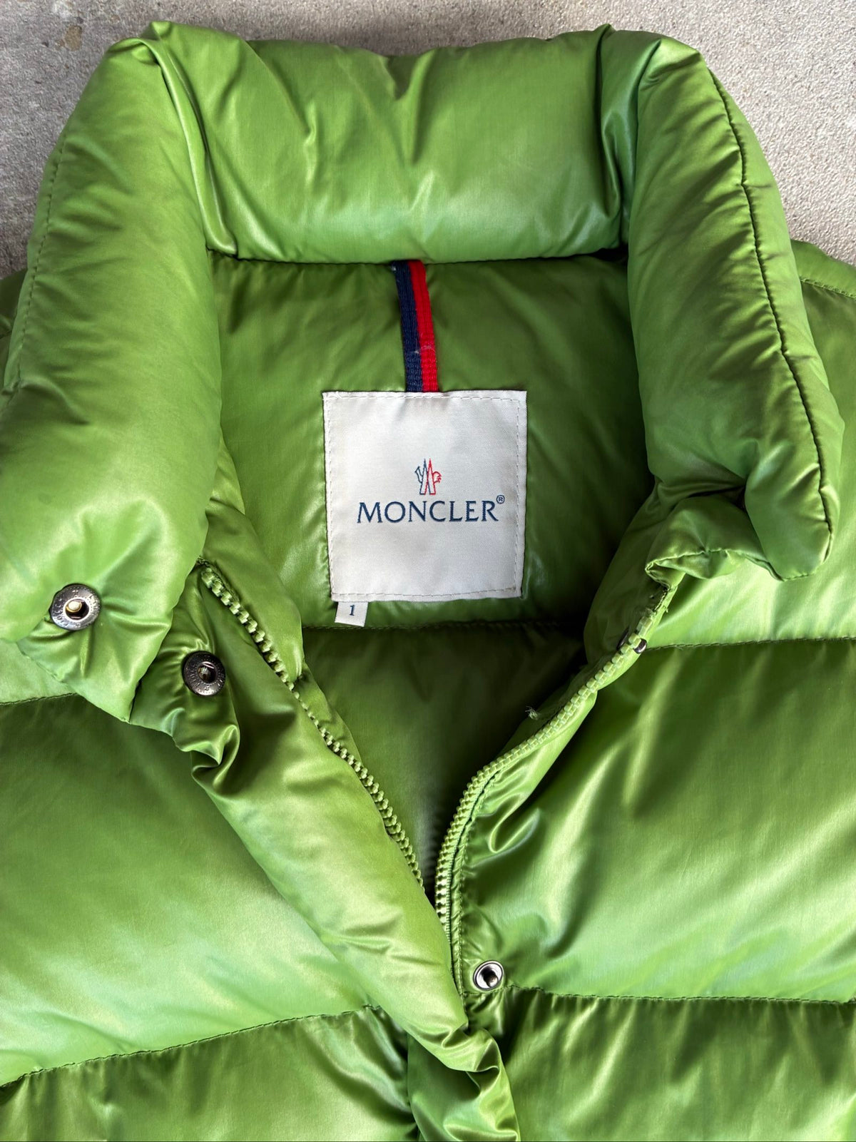 Moncler green puffer jacket with logo, 2004-2008, small oil mark below left arm.