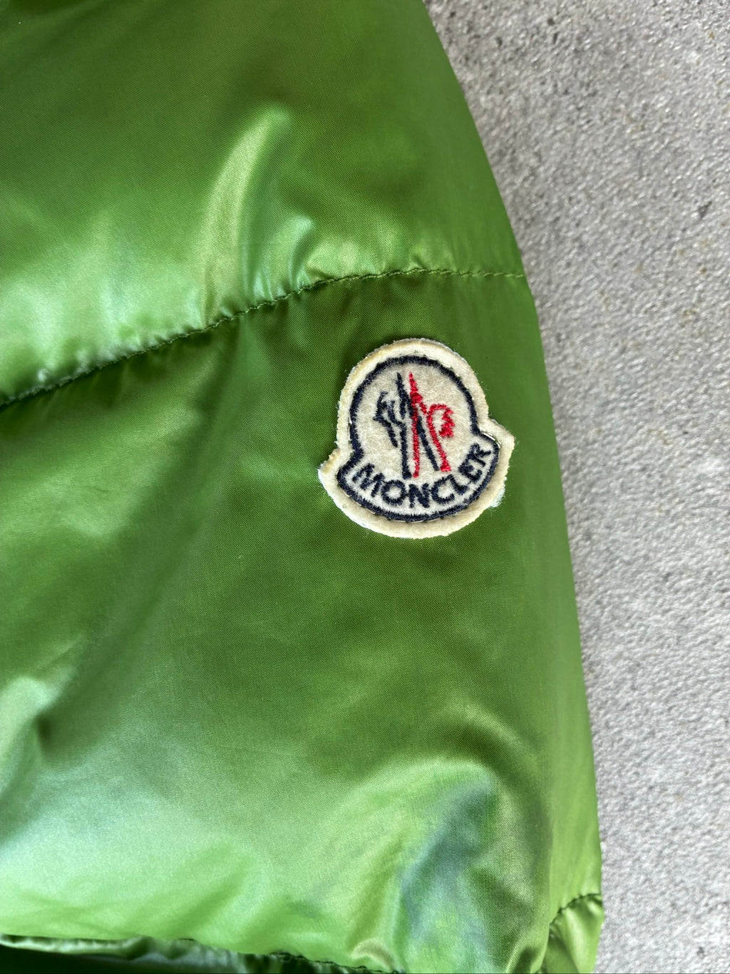 Moncler green puffer jacket with logo, 2004-2008, small oil mark below left arm.