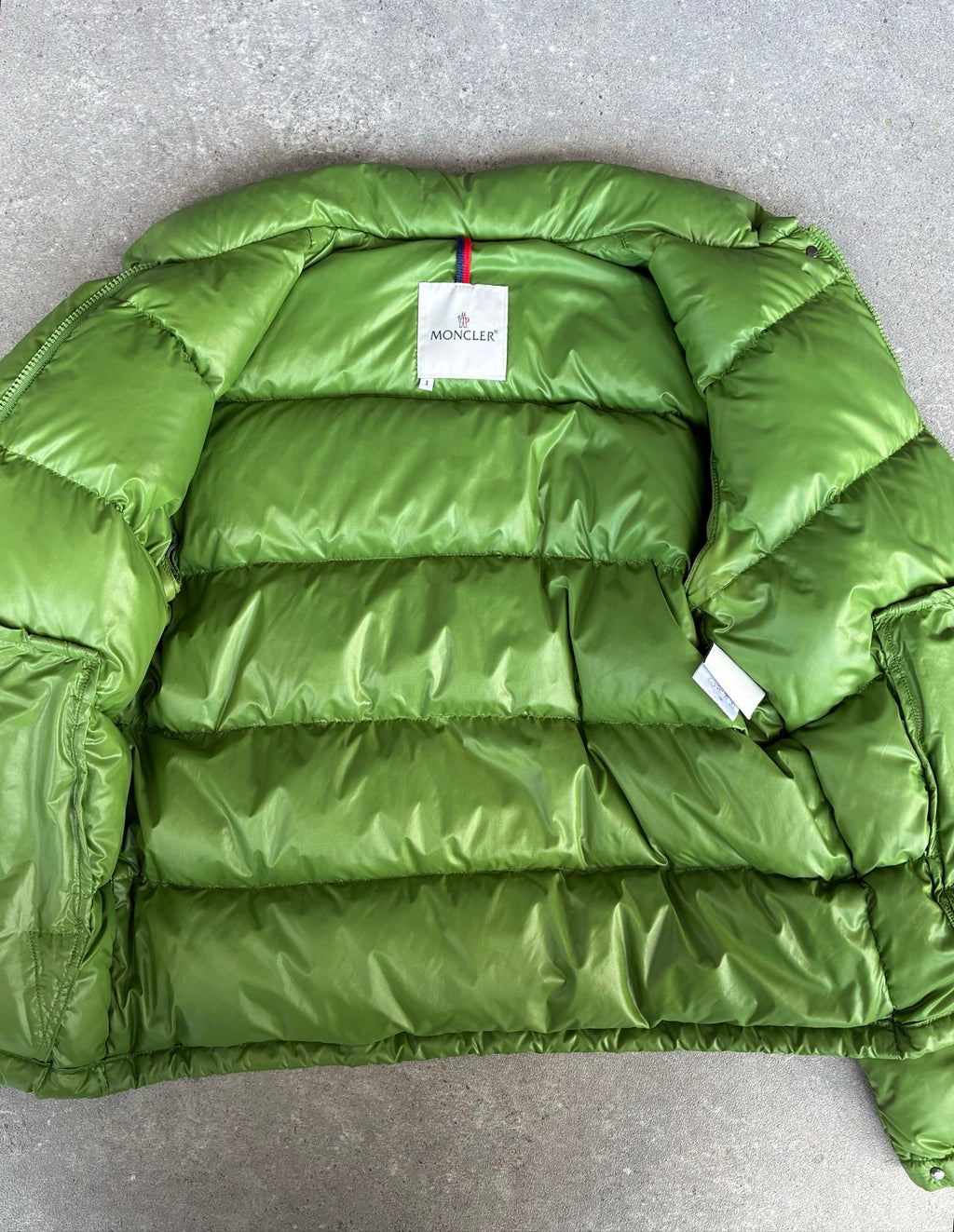 Moncler green puffer jacket with logo, 2004-2008, small oil mark below left arm.