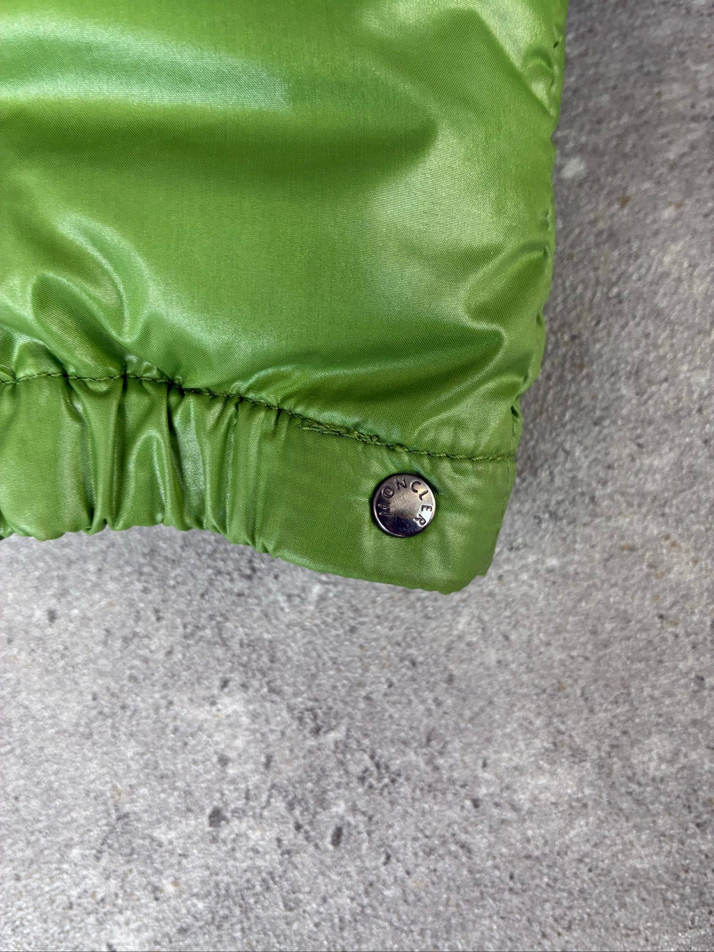 Moncler green puffer jacket with logo, 2004-2008, small oil mark below left arm.