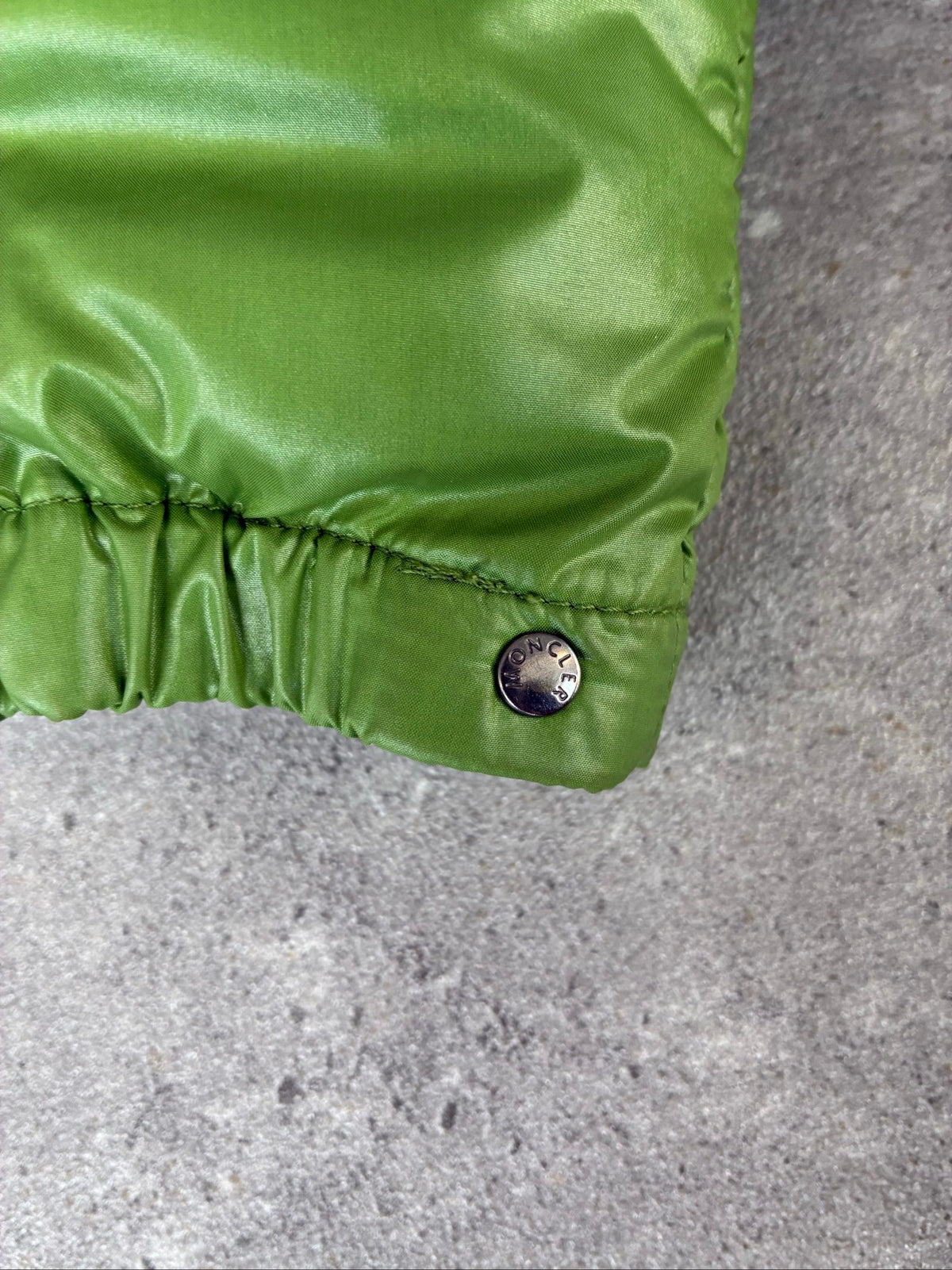 Moncler green puffer jacket with logo, 2004-2008, small oil mark below left arm.