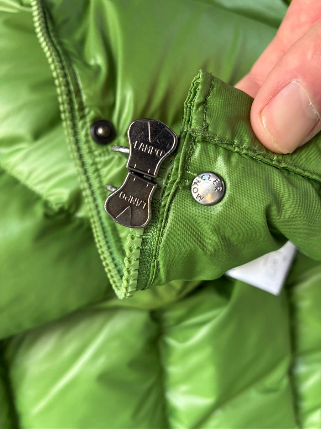 Moncler green puffer jacket with logo, 2004-2008, small oil mark below left arm.