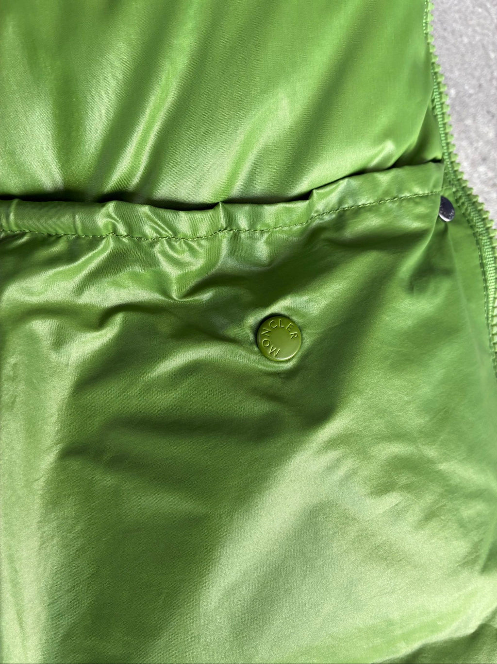 Moncler green puffer jacket with logo, 2004-2008, small oil mark below left arm.