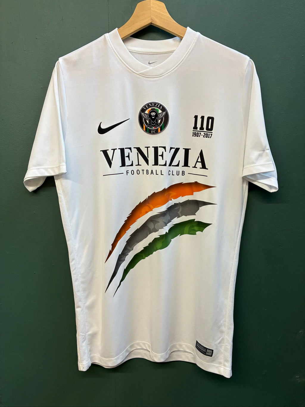 Nike football shirt white with raised Venezia logos, black and green accents.