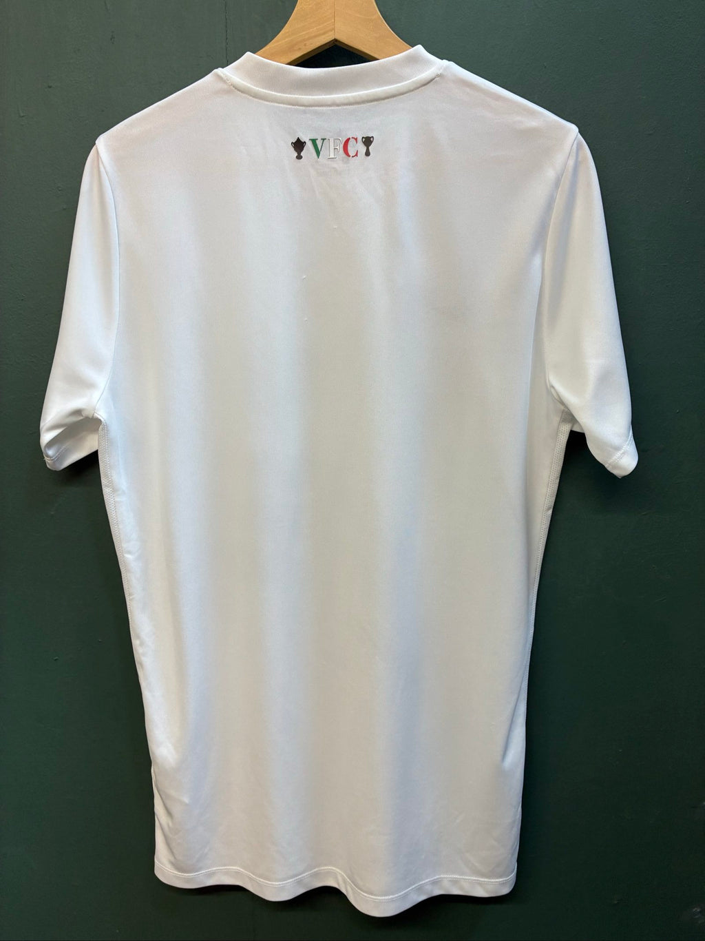 Nike football shirt white with raised Venezia logos, black and green accents.