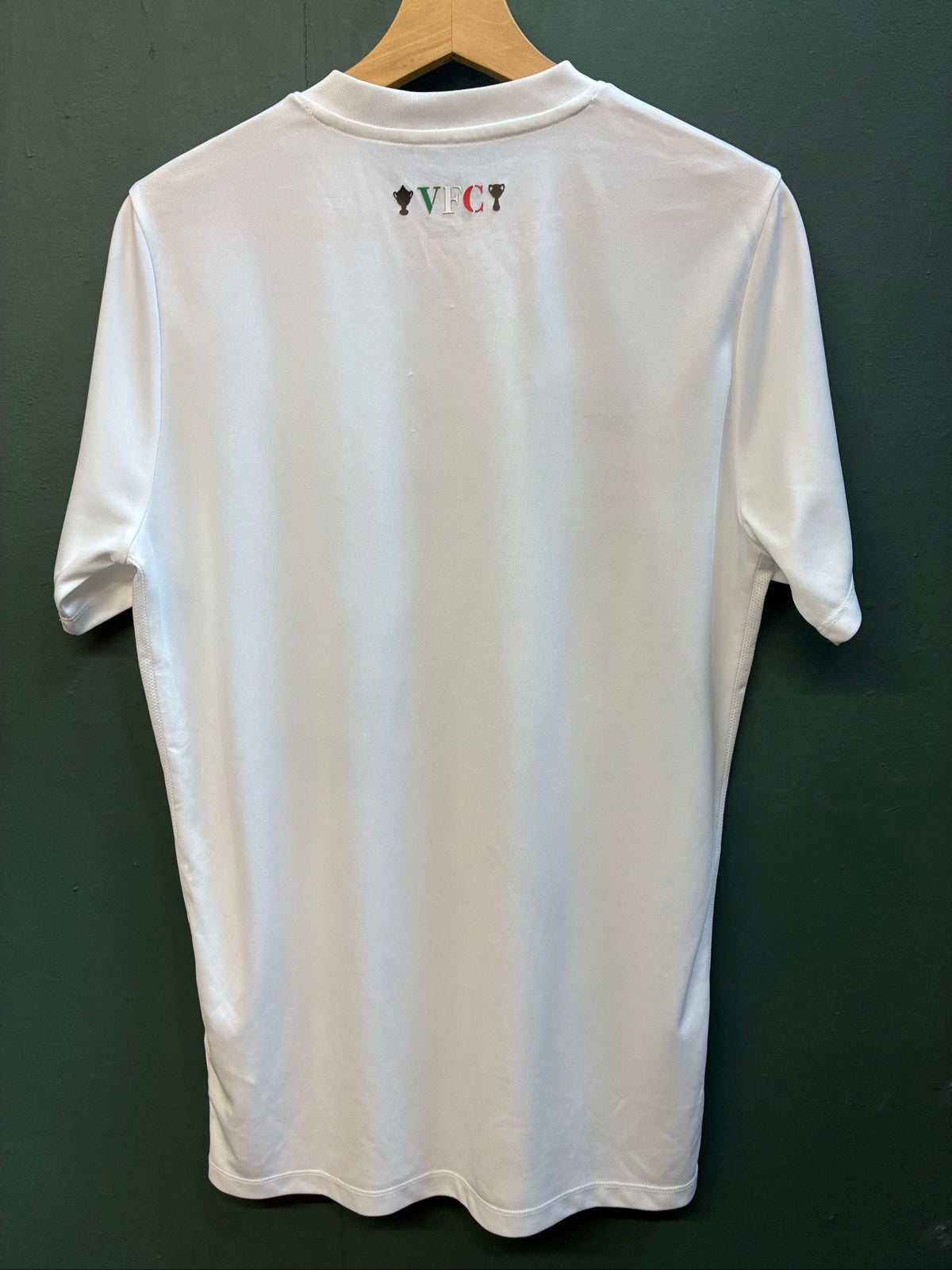 Nike football shirt white with raised Venezia logos, black and green accents.