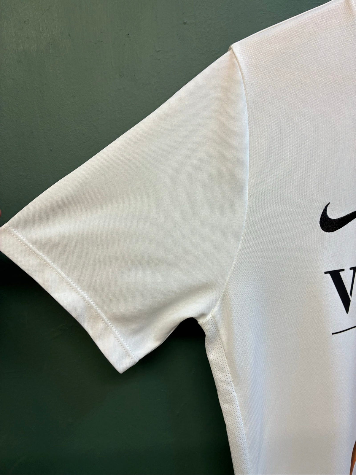 Nike football shirt white with raised Venezia logos, black and green accents.