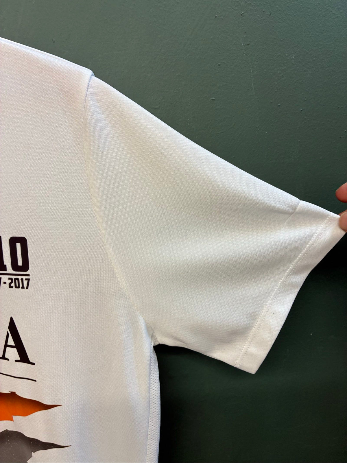 Nike football shirt white with raised Venezia logos, black and green accents.