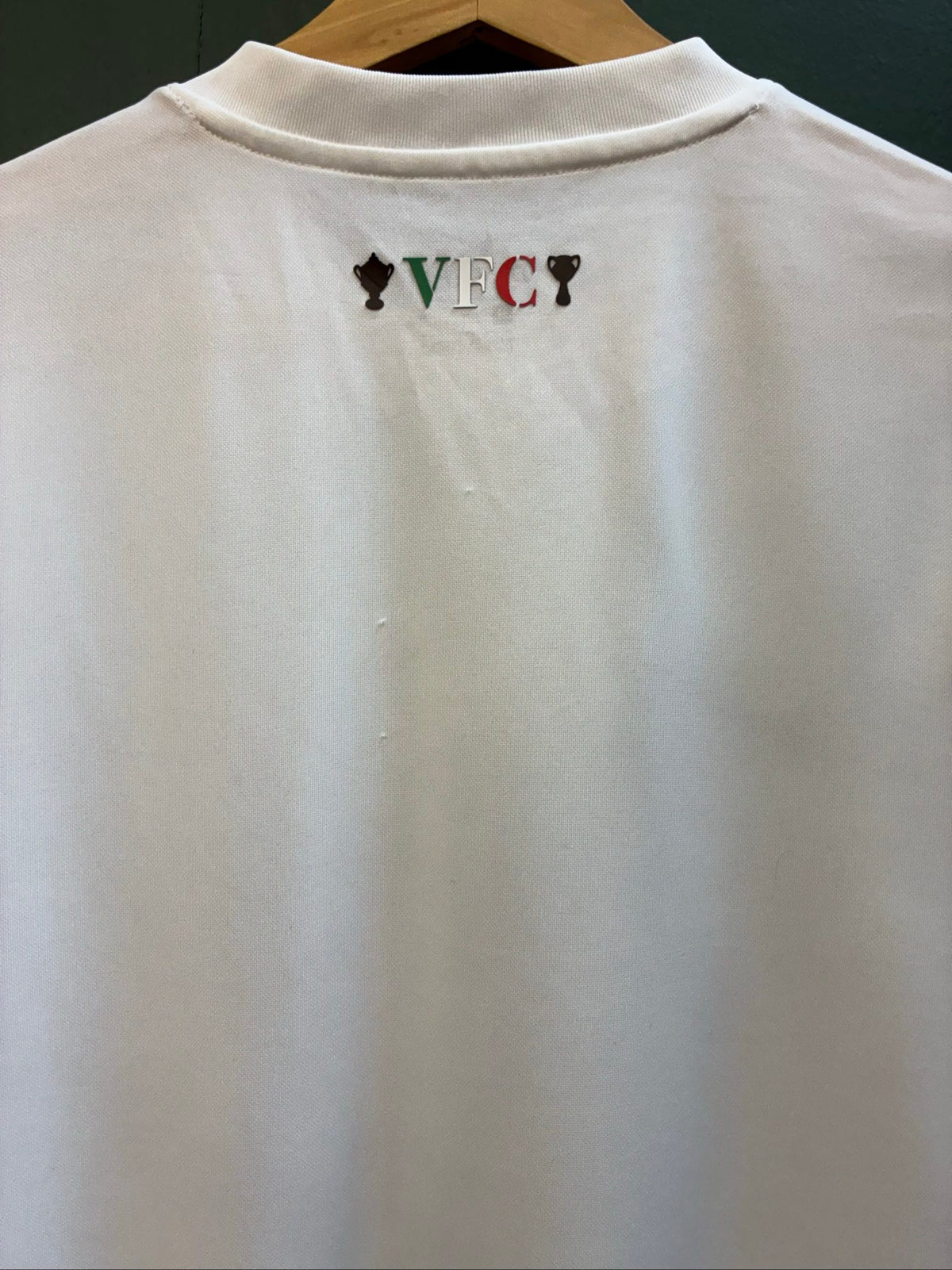 Nike football shirt white with raised Venezia logos, black and green accents.