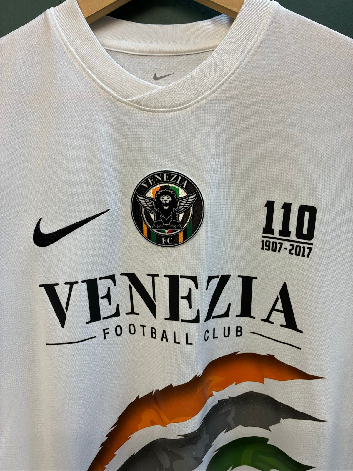 Nike football shirt white with raised Venezia logos, black and green accents.