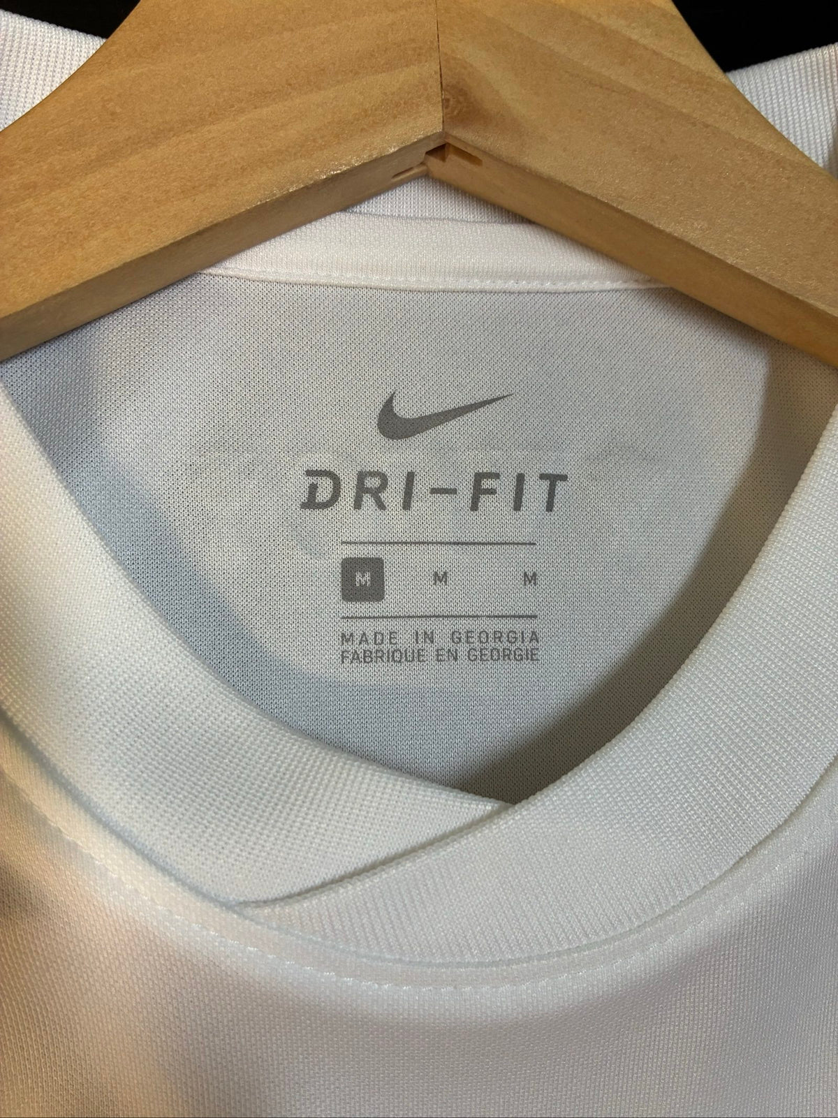 Nike football shirt white with raised Venezia logos, black and green accents.