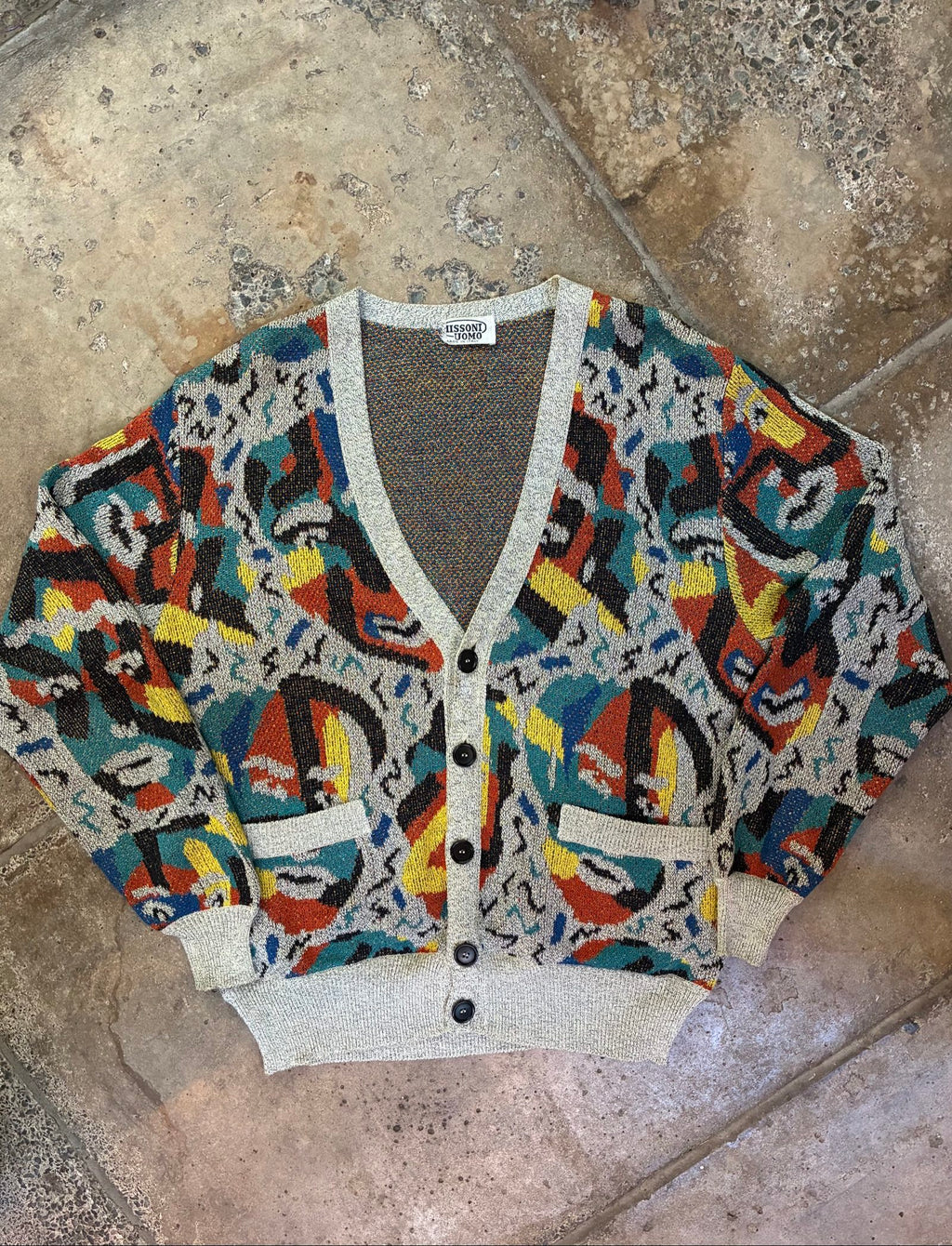 Missoni grey, orange, yellow cardigan with abstract Picasso knit pattern and oversized fit.