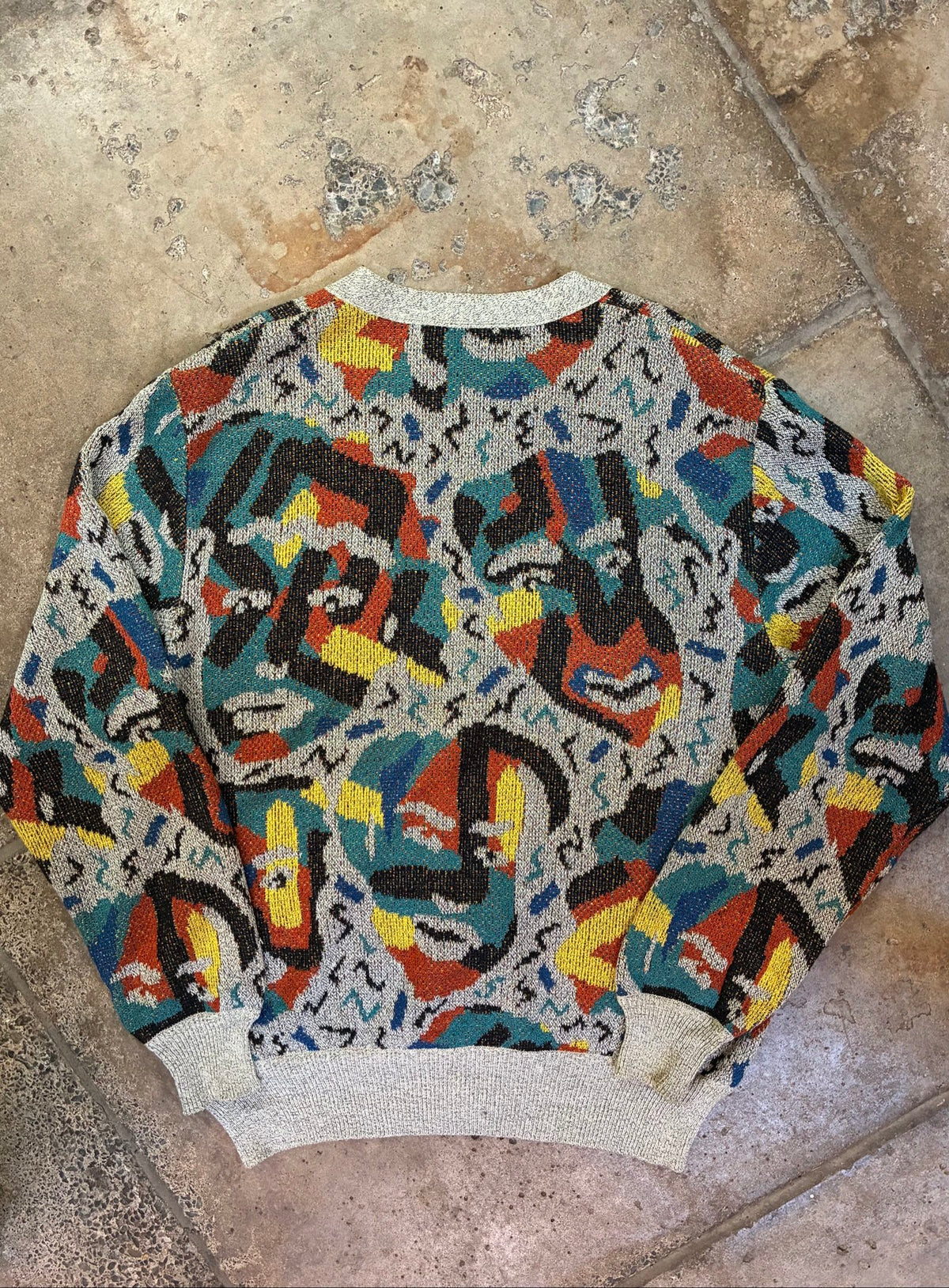 Missoni grey, orange, yellow cardigan with abstract Picasso knit pattern and oversized fit.