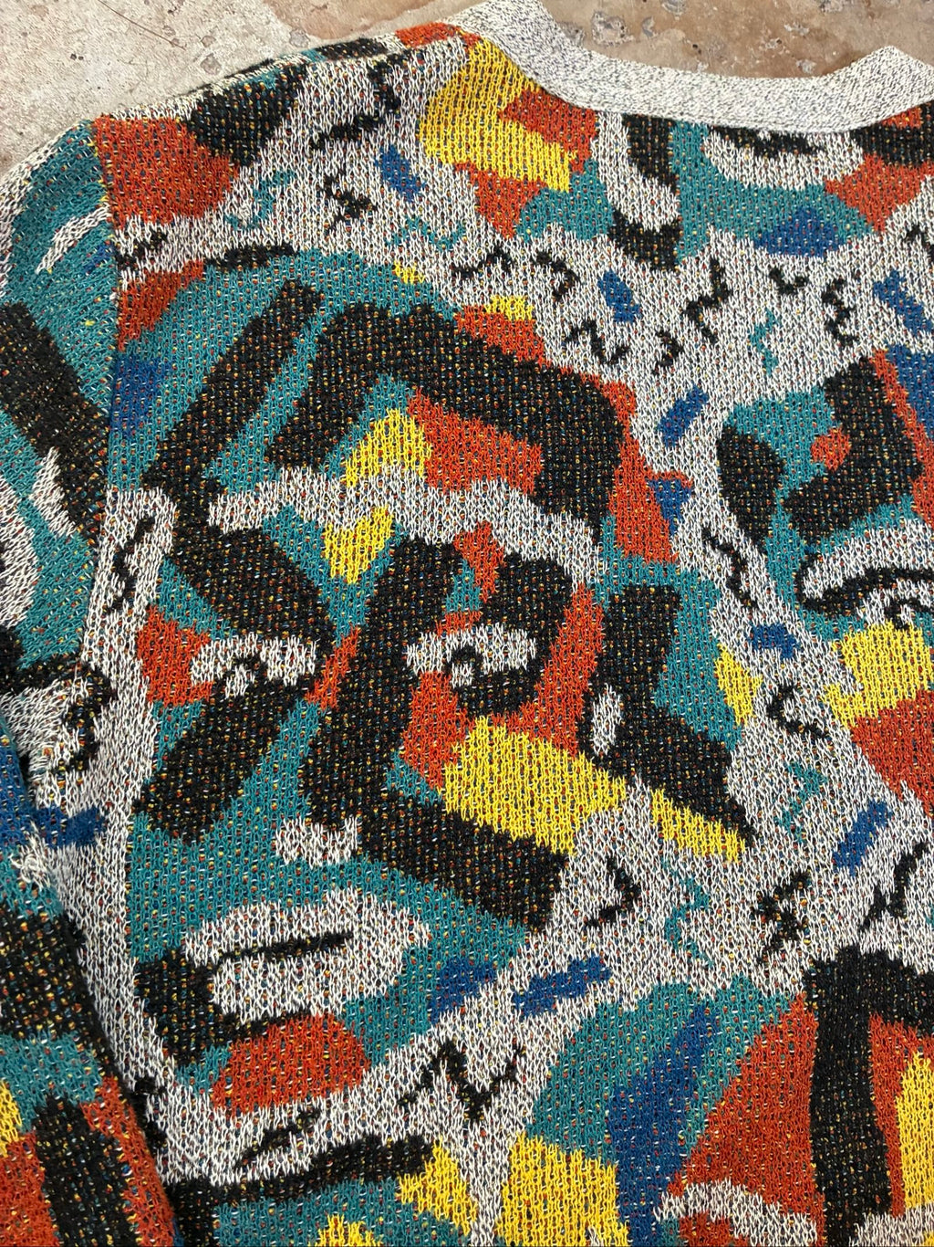 Missoni grey, orange, yellow cardigan with abstract Picasso knit pattern and oversized fit.