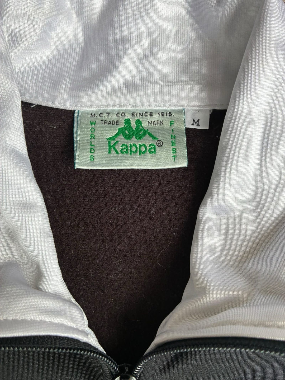 Kappa vintage Juventus track jacket black green white with logo and 90s design.