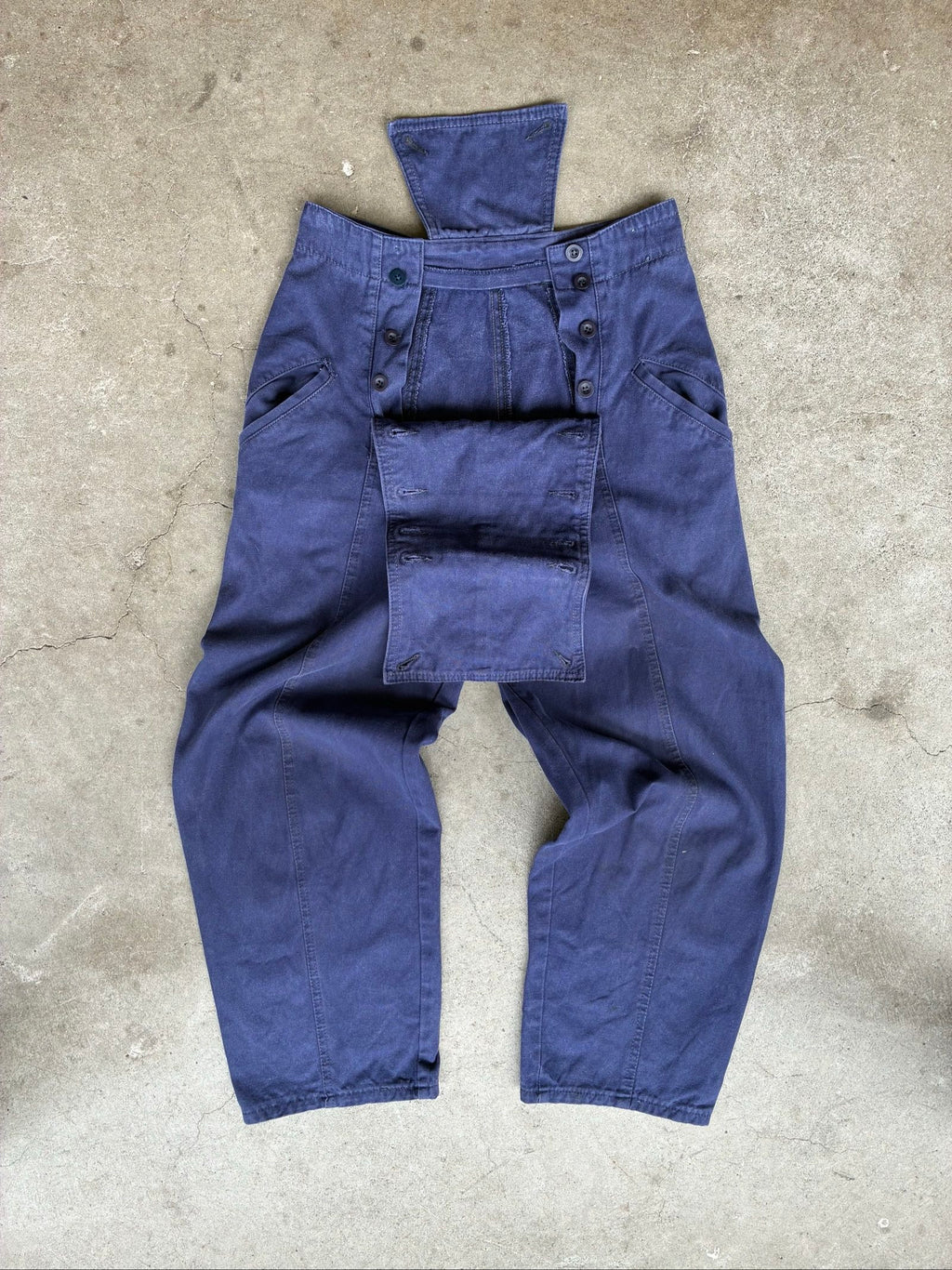 Benetton navy cotton workwear trousers with multiple button fastening and faded fabric.