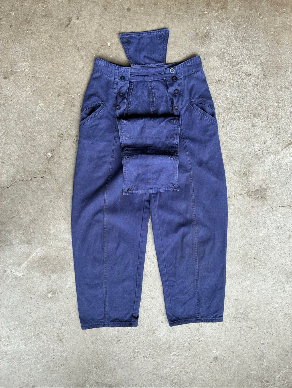 Benetton navy cotton workwear trousers with multiple button fastening and faded fabric.