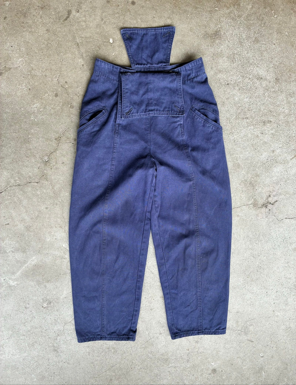 Benetton navy cotton workwear trousers with multiple button fastening and faded fabric.