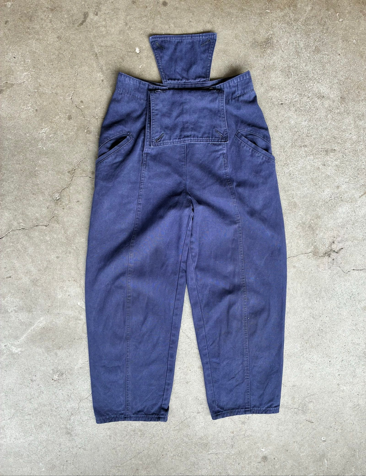 Benetton navy cotton workwear trousers with multiple button fastening and faded fabric.