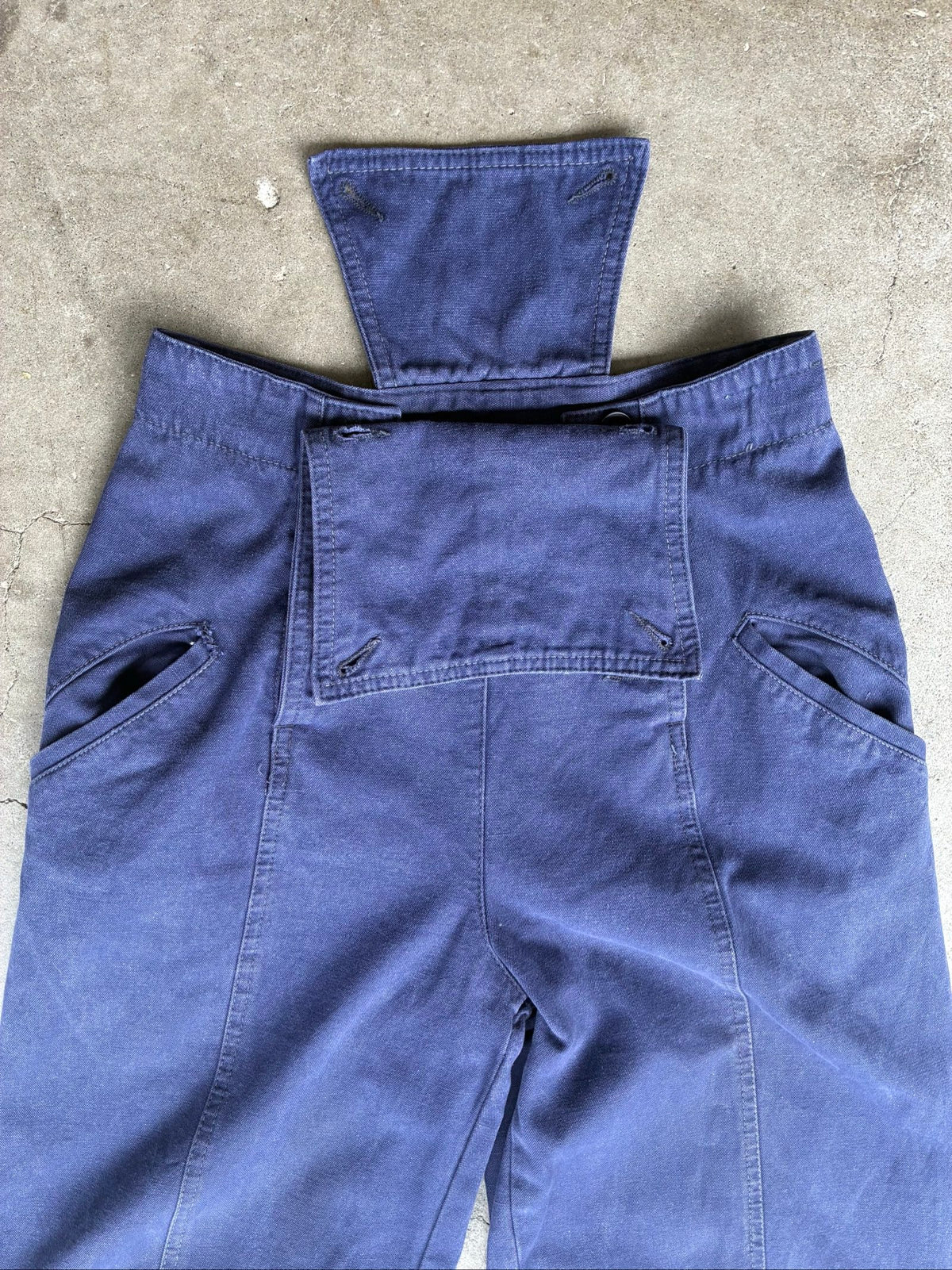 Benetton navy cotton workwear trousers with multiple button fastening and faded fabric.