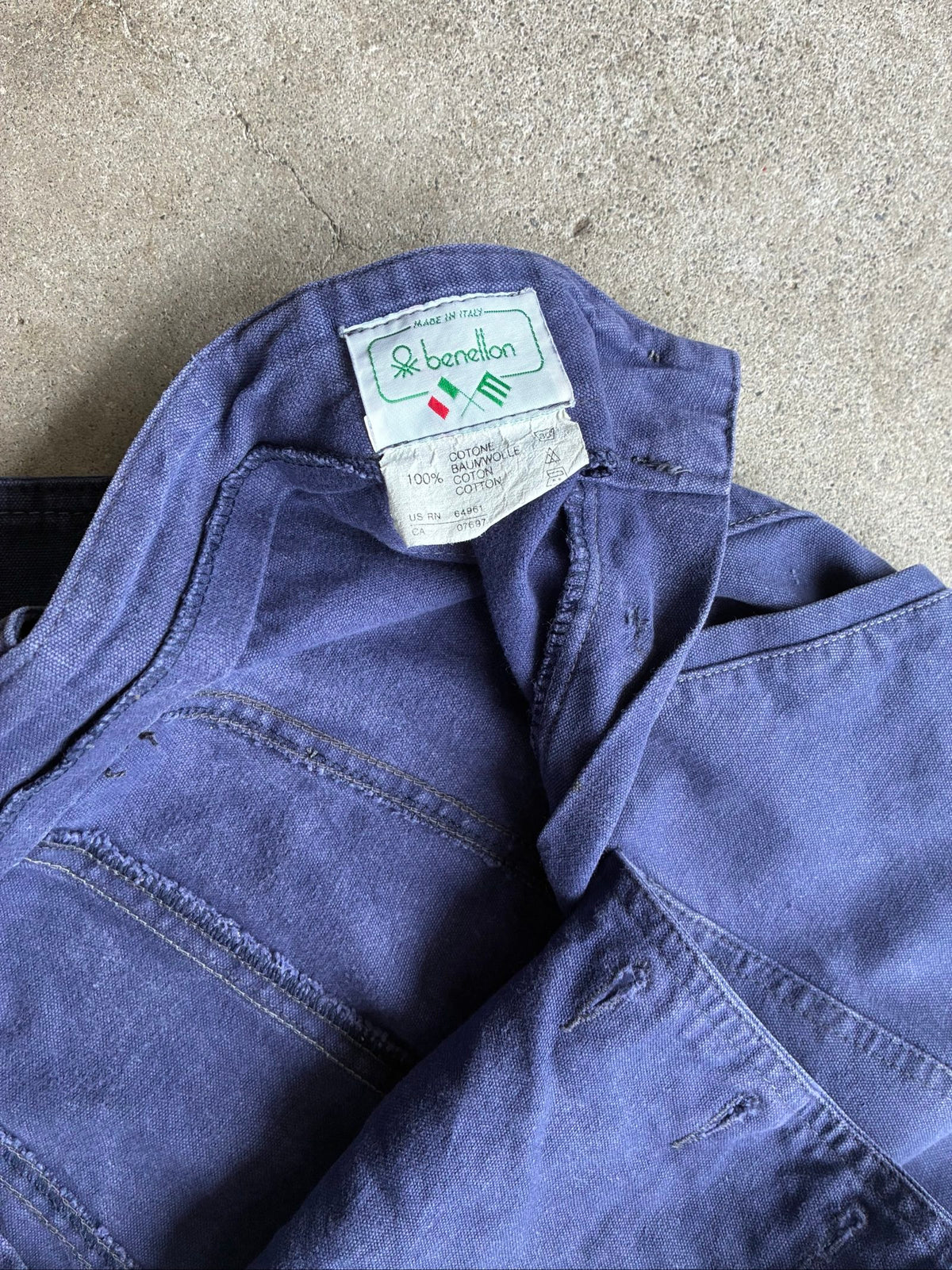 Benetton navy cotton workwear trousers with multiple button fastening and faded fabric.
